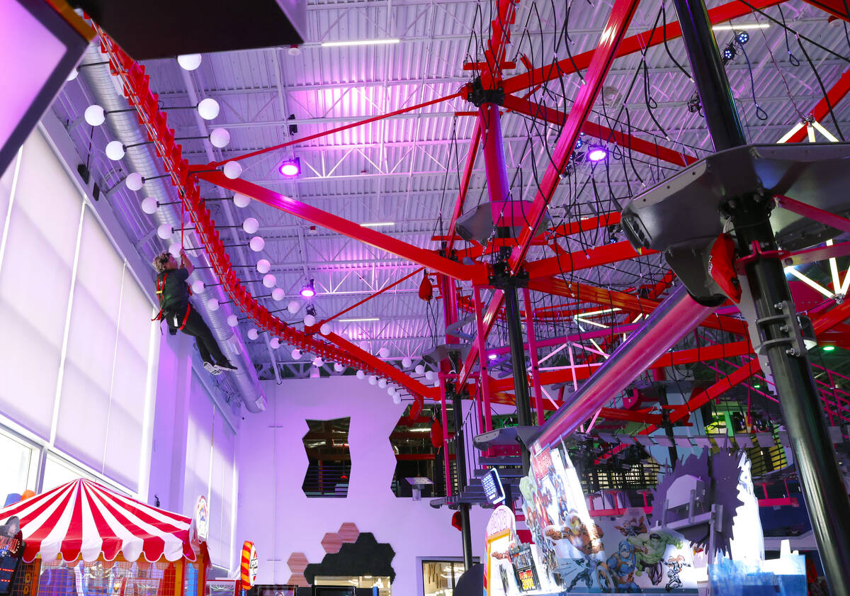 An employee inspects a sky rail at Spy Ninja HQ, the World's First YouTuber Theme Park, on Thur ...
