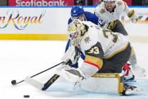 Vegas Golden Knights goaltender Adin Hill (33) saves a shot from Toronto Maple Leafs' Mitchell ...