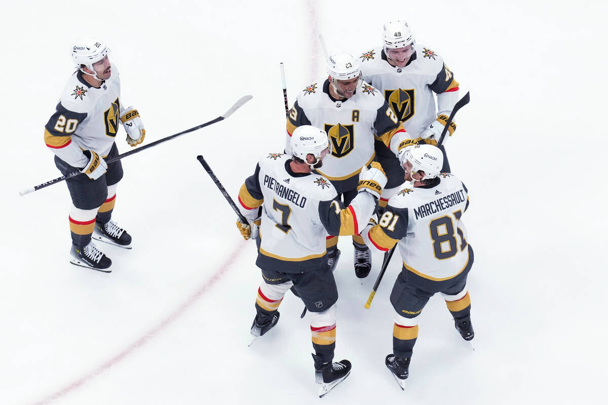 Vegas Golden Knights players celebrate after Alex Pietrangelo scored against the Toronto Maple ...