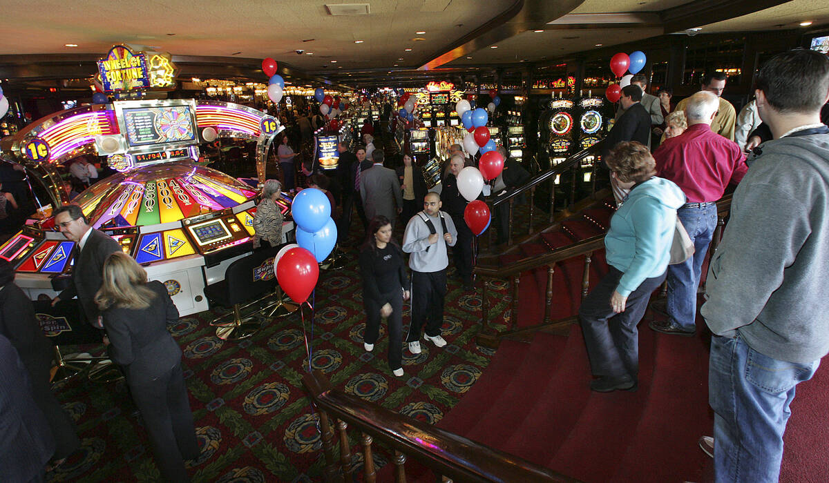 People walk around inside the onetime Barbary Coast as it is formally reopened as Bill's Gambli ...