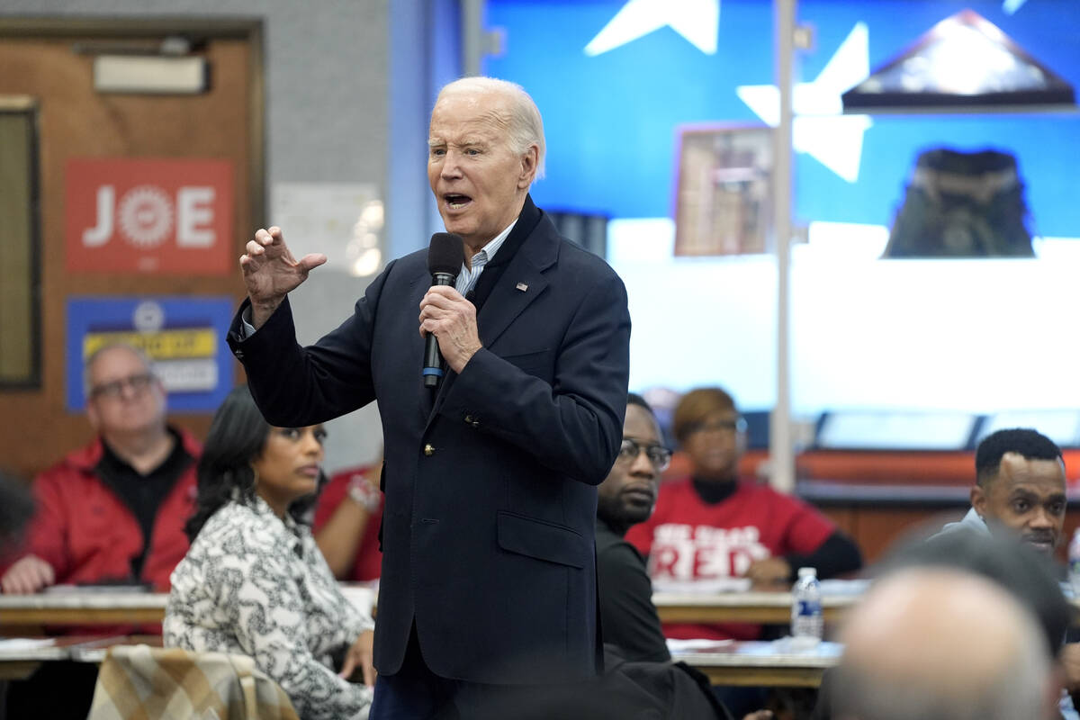 FILE - President Joe Biden meets with UAW members during a campaign stop at a phone bank in the ...