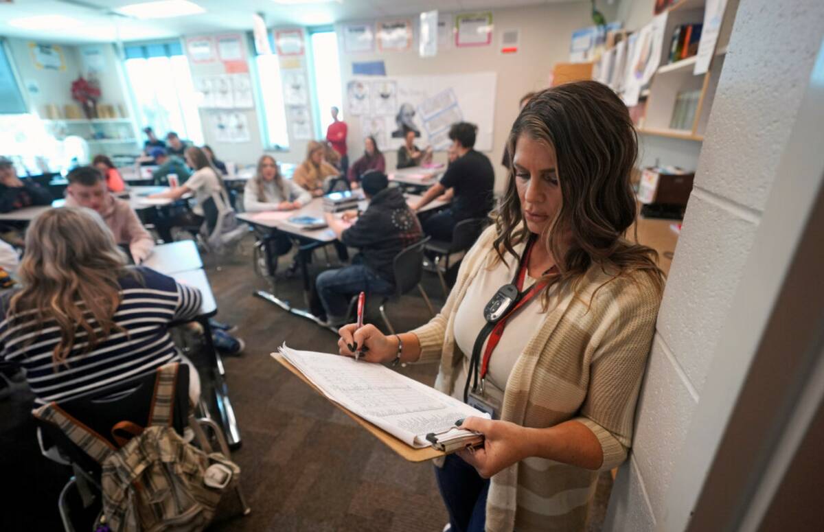 Kelli Anderson takes attendance from the rear of her Language Arts 9 class at Delta High School ...