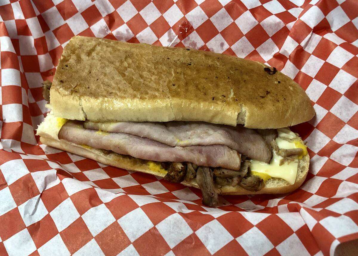 A Cubano from Miami Grill, which opened in December 2023 in a Walmart in Henderson. Pitbull, th ...