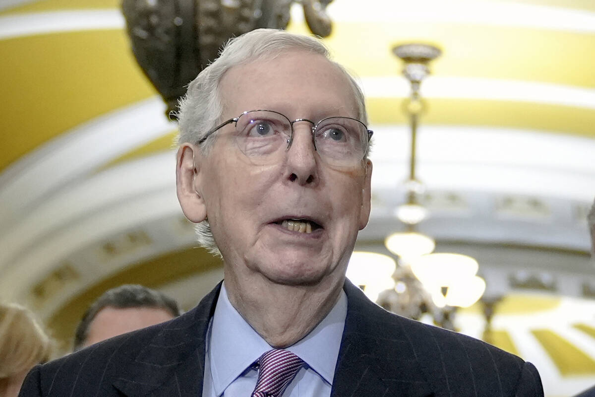 Senate Minority Leader Mitch McConnell, R-Ky., talks after a policy luncheon on Capitol Hill Tu ...