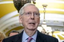 Senate Minority Leader Mitch McConnell, R-Ky., talks after a policy luncheon on Capitol Hill Tu ...
