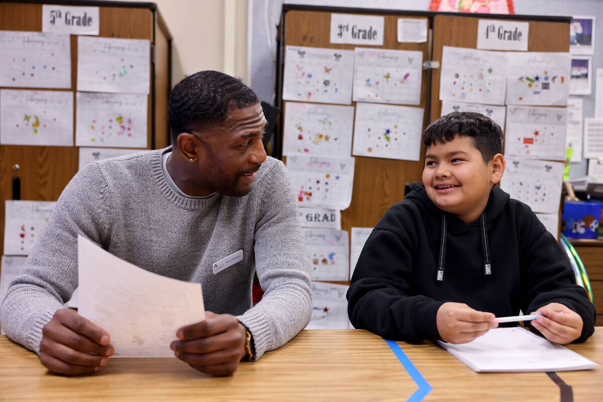 Communities In Schools of Southern Nevada Site Coordinator Raul Fention works with fifth grader ...