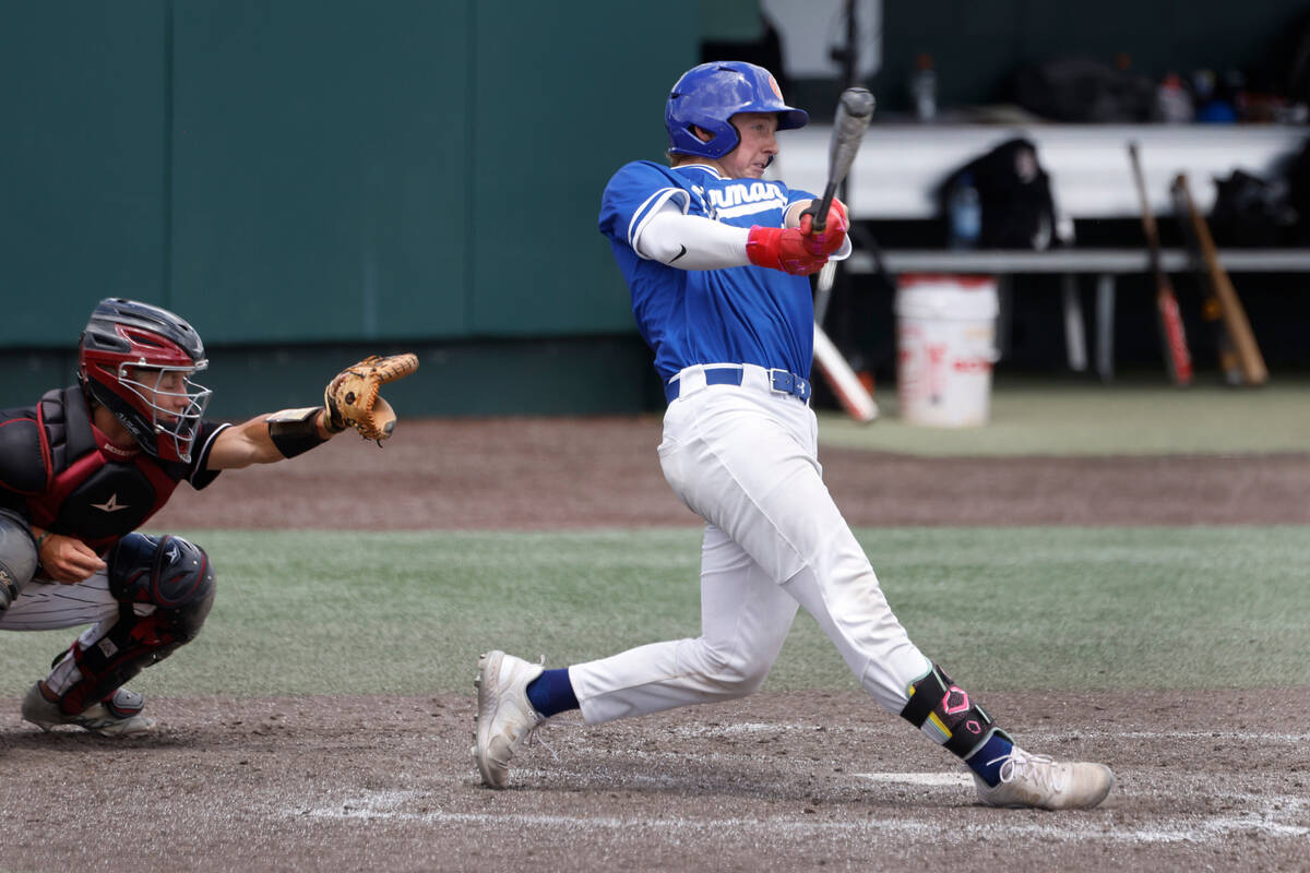 Bishop Gorman's Burke Mabeus connects for a hit against Desert Oasis during a Class 5A high sch ...