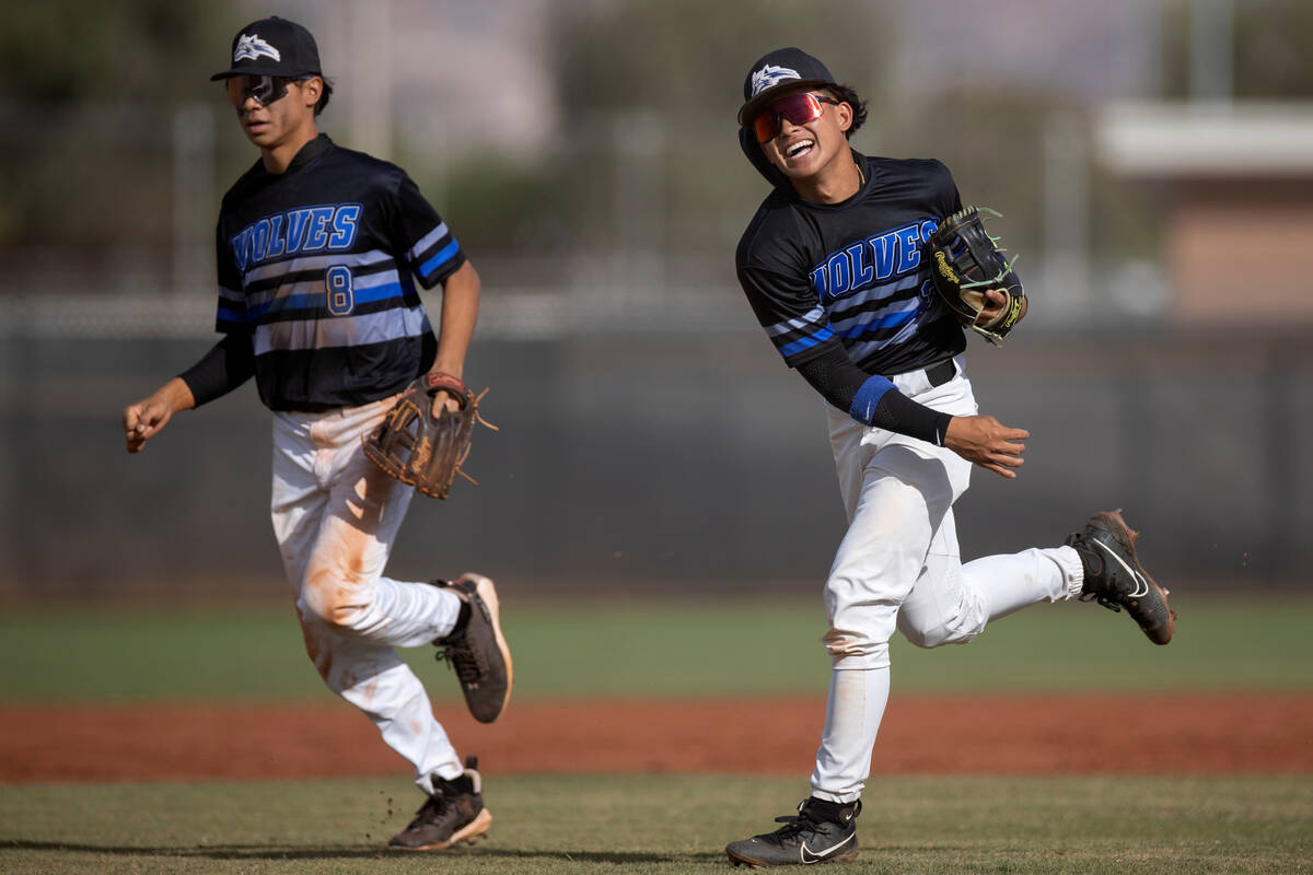 Basic’s Tate Southisene (8) and Ty Southisene, right, celebrate a fast inning against Co ...