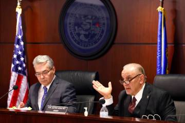 The Nevada Control Board Chairman Kirk Hendrick, left, listens to Gaming Control Board member G ...