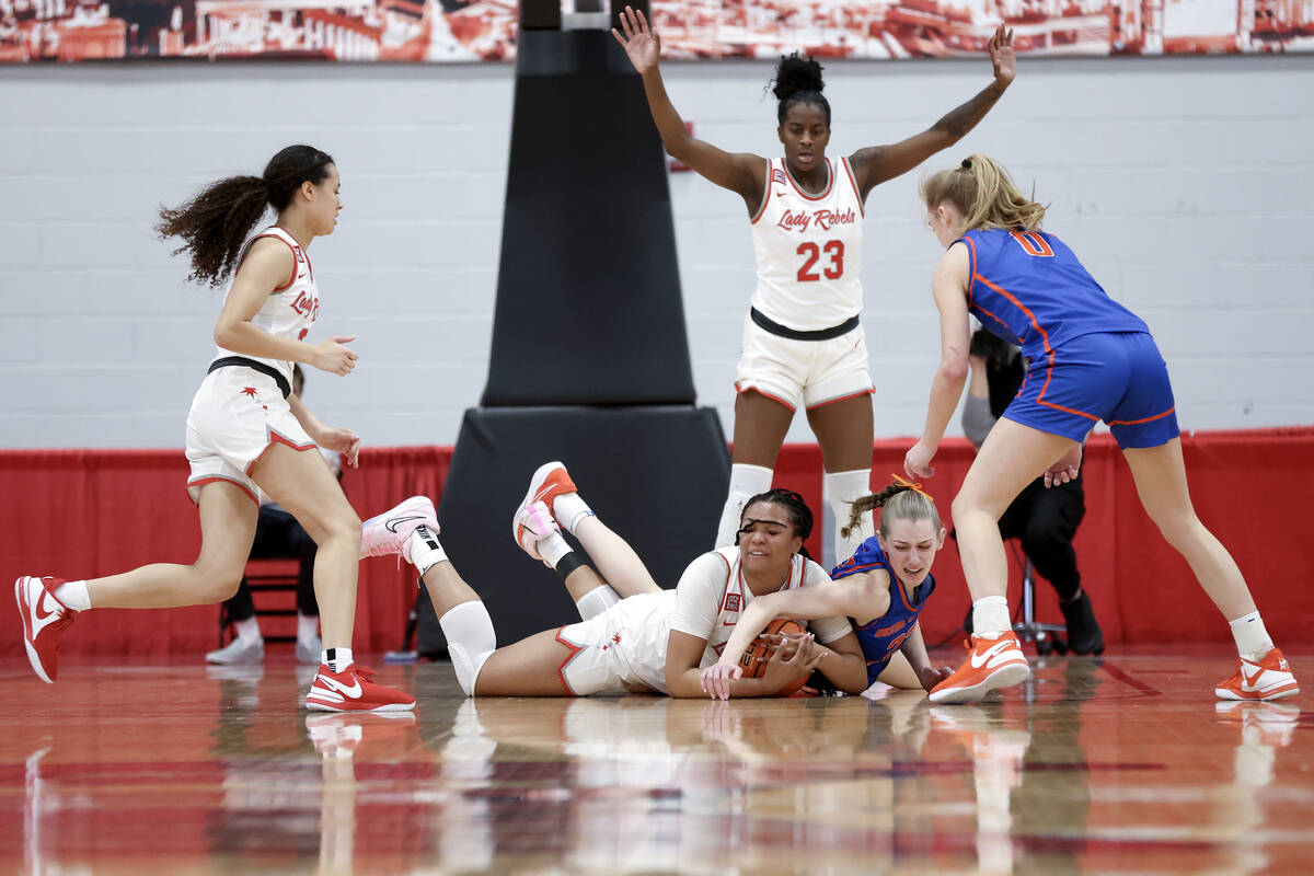 UNLV Lady Rebels forward Alyssa Brown (44) struggles for the ball against Boise State Broncos f ...