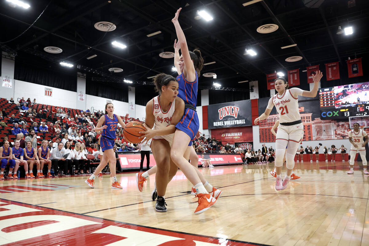 UNLV Lady Rebels forward Nneka Obiazor (1) passes around Boise State Broncos forward Alyssa Chr ...