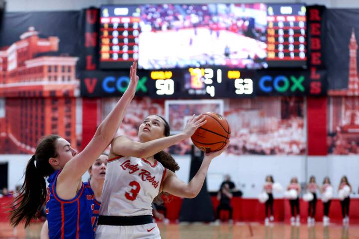 UNLV Lady Rebels guard Kiara Jackson (3) shoots against Boise State Broncos forward Trista Hull ...