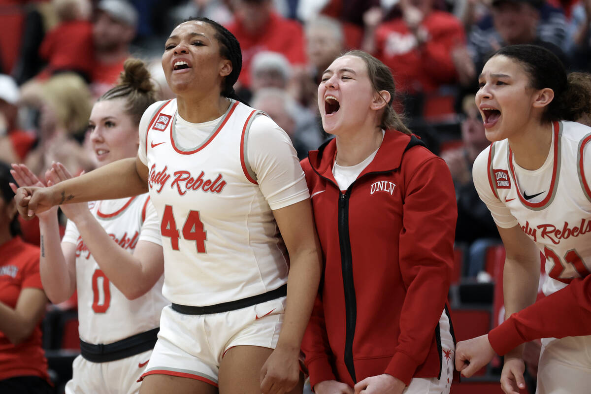 The UNLV Lady Rebels bench goes wild for their team during the second half of an NCAA college b ...
