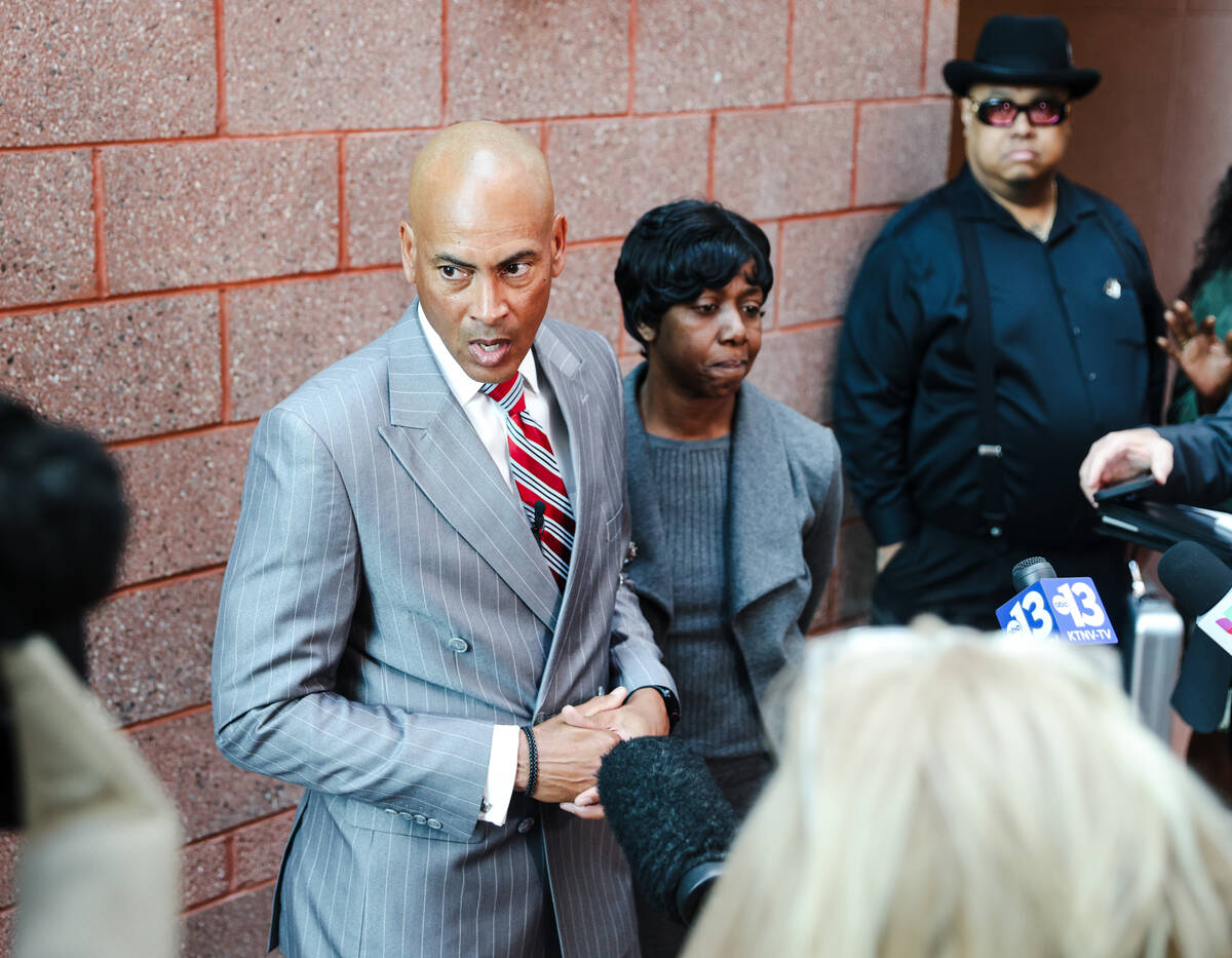 Defense attorney Carl Arnold addresses the media next to the family of Deobra Redden, who was c ...