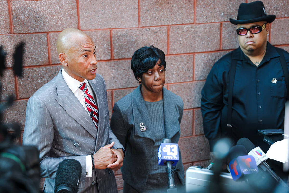 Defense attorney Carl Arnold addresses the media next to the family of Deobra Redden, who was c ...