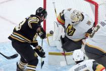 Boston Bruins left wing Brad Marchand (63) tries to score as Vegas Golden Knights goaltender Ad ...