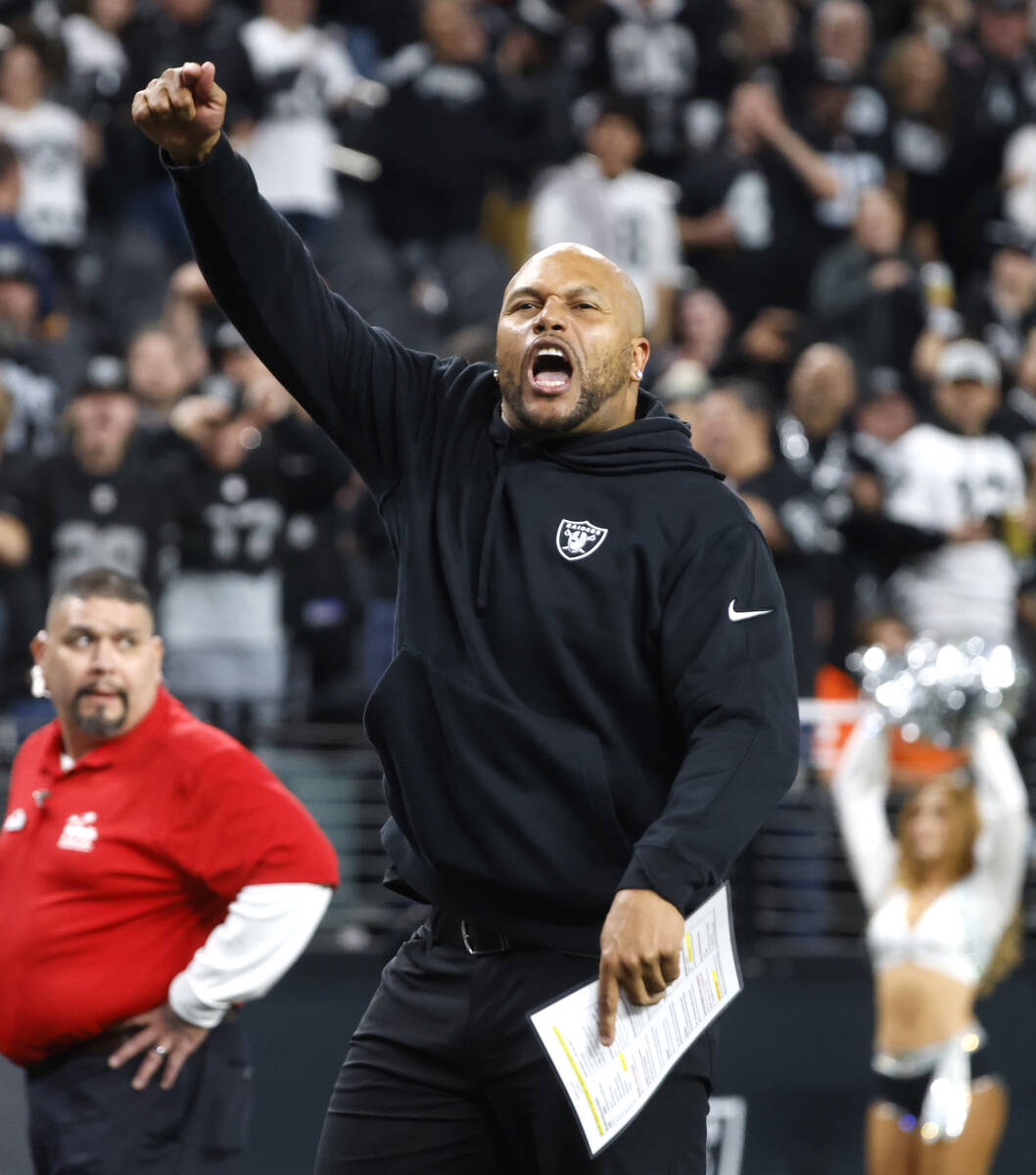 Raiders Interim Coach Antonio Pierce reacts as he leaves the field after beating the Denver Bro ...