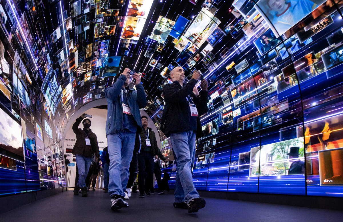 Attendees walk through an installation highlighting LG Electronics' webOS smart TV platform dur ...