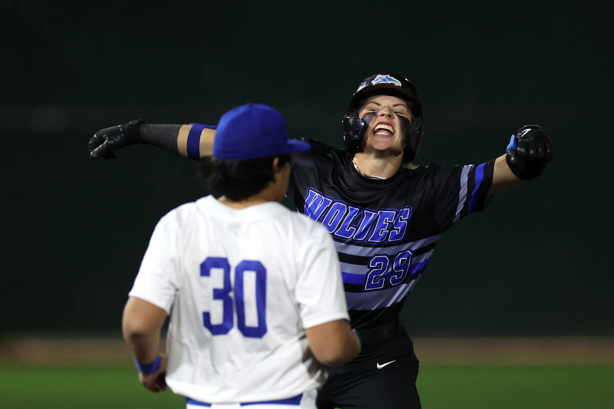 Basic’s Andruw Giles (29) celebrates after hitting a double while Bishop Gorman’s ...