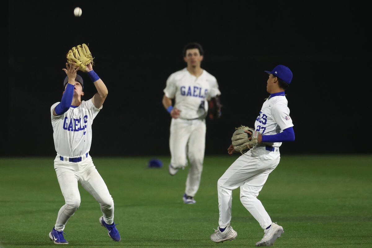 Bishop Gorman short stop Colton Boardman (7) prepares to catch for an out next to second basema ...