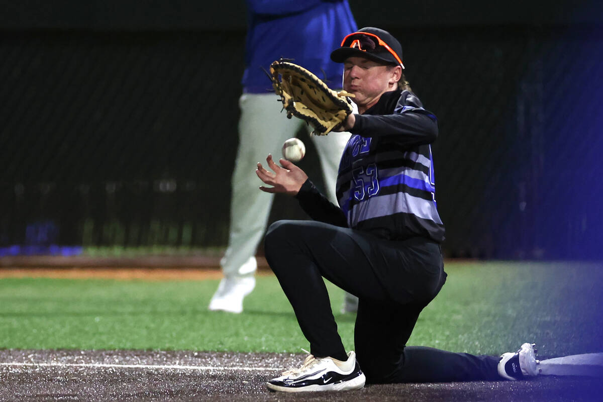 Basic first baseman Randall Riley (53) misses a catch during a high school baseball game agains ...
