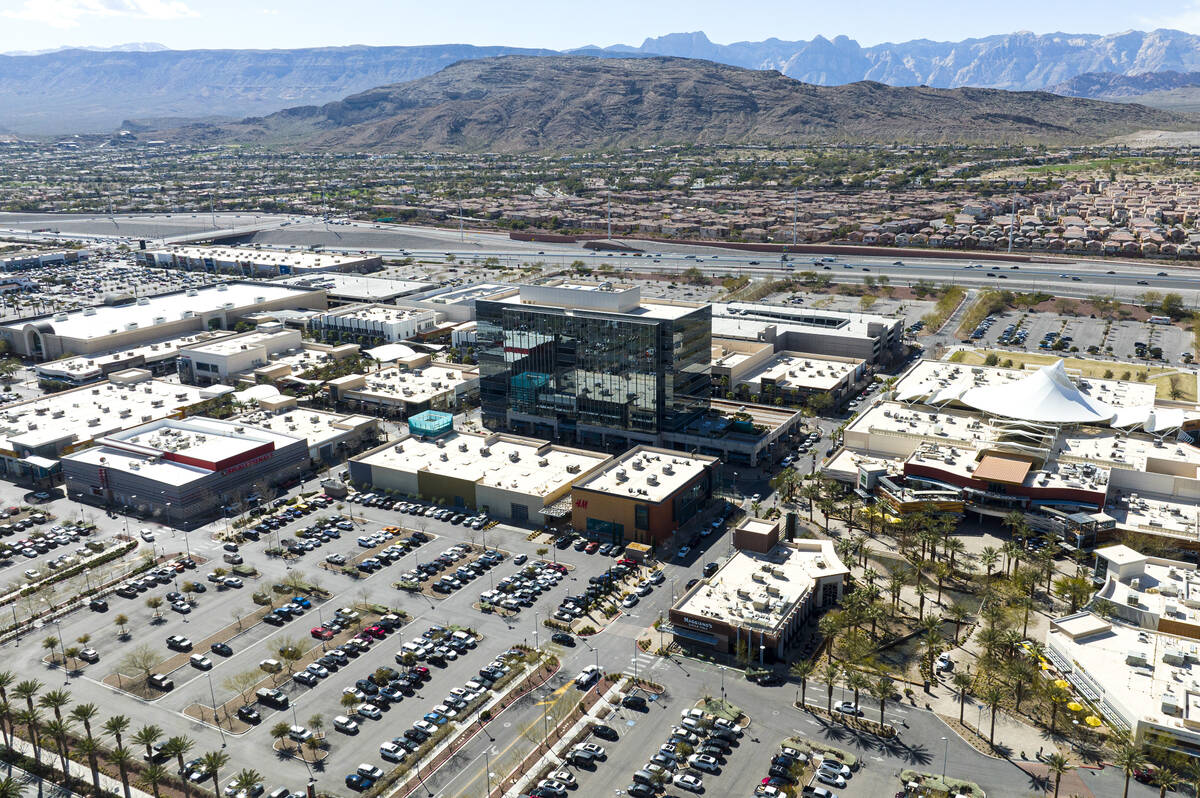 An aerial view of One Summerlin, a 9-story office building, center, and downtown Summerlin, on ...