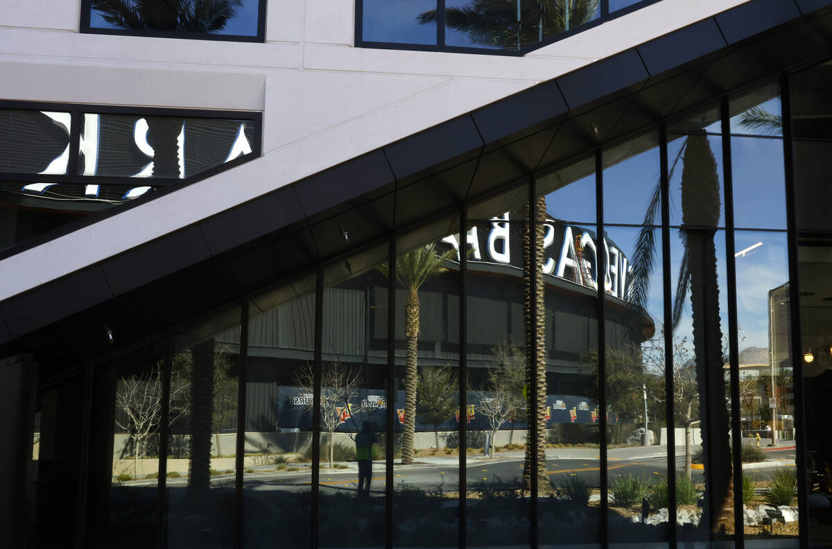 Las Vegas Ballpark is reflected in the glass facade of 1700 Pavilion, a 10-story office buildin ...