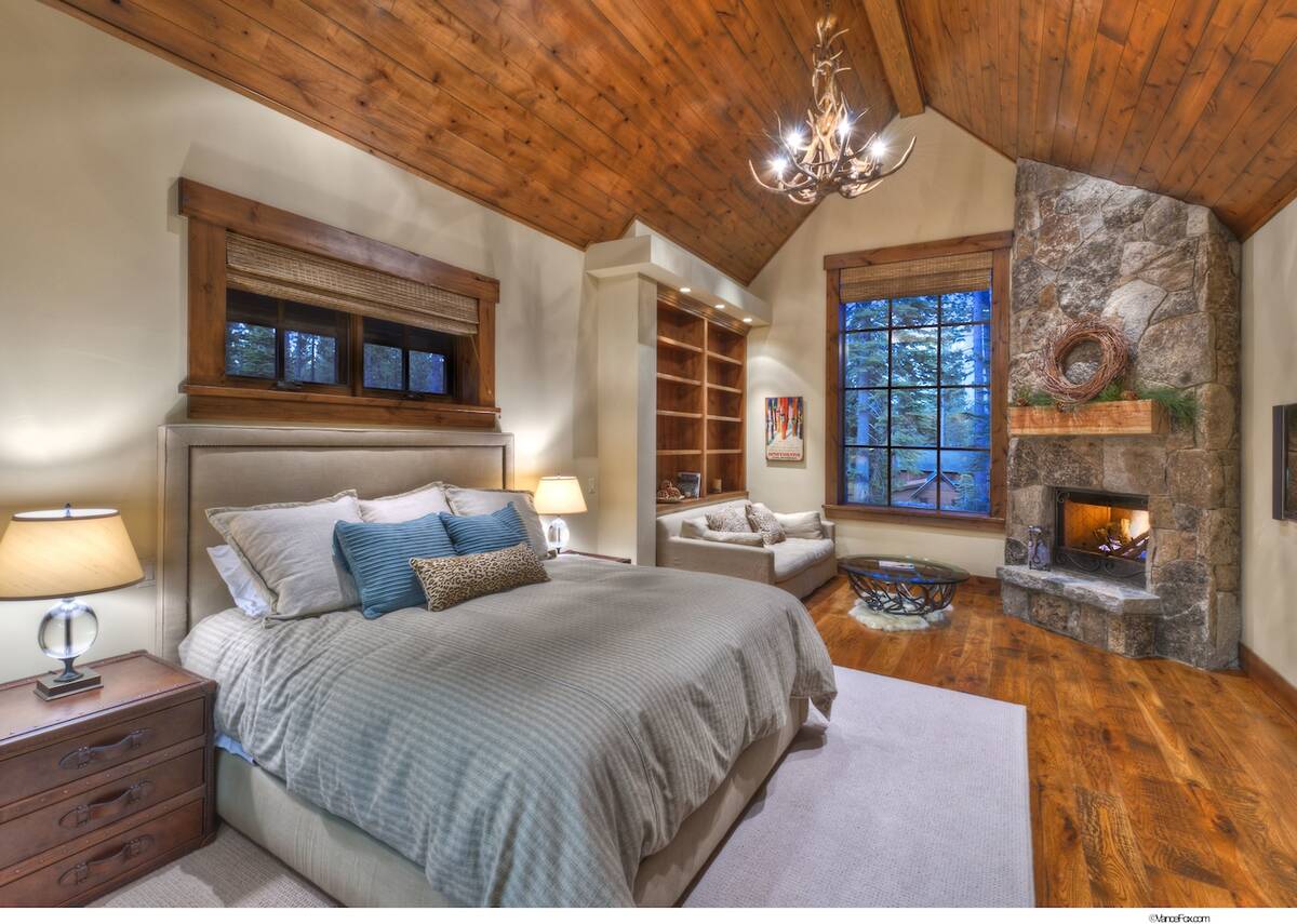 Down the hall is an office and one of two primary suites with a fireplace. (Vance Fox)