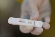 A COVID-19 rapid test is seen in this AP file photo. (AP Photo/Andre Penner)