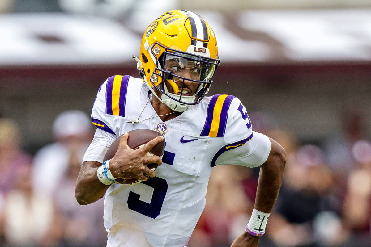 FILE - LSU quarterback Jayden Daniels (5) during the first half of an NCAA football game on Sa ...