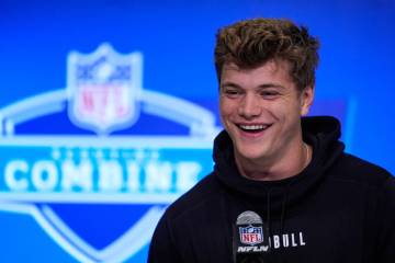 Michigan quarterback J.J. McCarthy speaks during a press conference at the NFL football scoutin ...