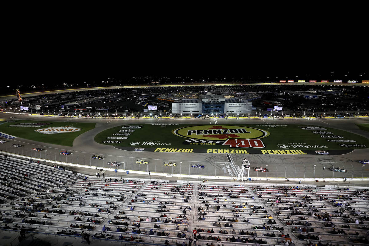 Drivers round the track during the Victoria's Voice Foundation 200 NASCAR Craftsman Truck Serie ...