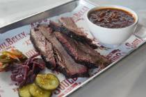 Brisket and baked beans from the SoulBelly BBQ menu at The Sundry food hall in the UnCommons de ...
