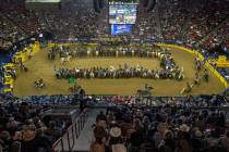 Competitors gather in the arena as the fans applaud at the start of the opening night of Wrangl ...