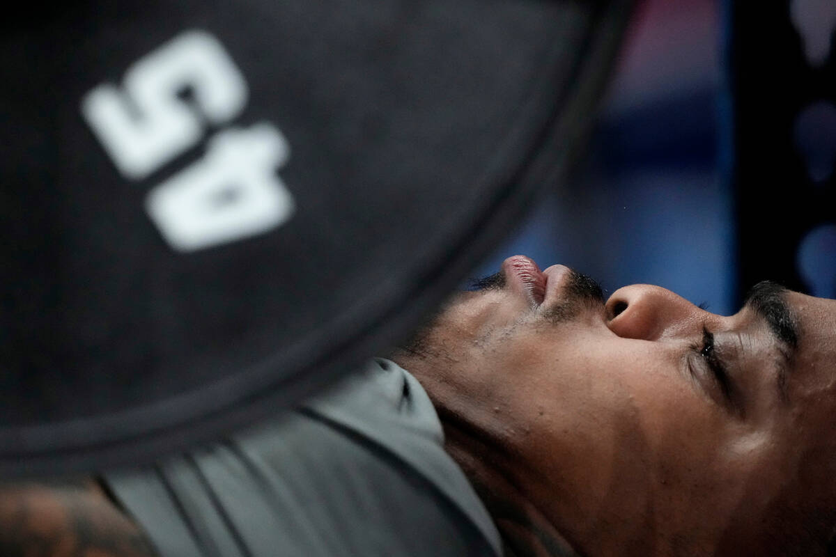 Texas defensive lineman Byron Murphy lifts weights during the NFL football scouting combine, Fr ...