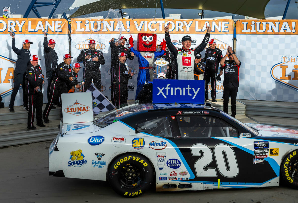 Driver John Hunter Nemechek, 20, is doused by water by his team after winning the LiUNA NASCAR ...