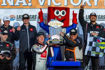 Driver John Hunter Nemechek, 20, holds up his trophy after winning the LiUNA NASCAR Xfinity Ser ...