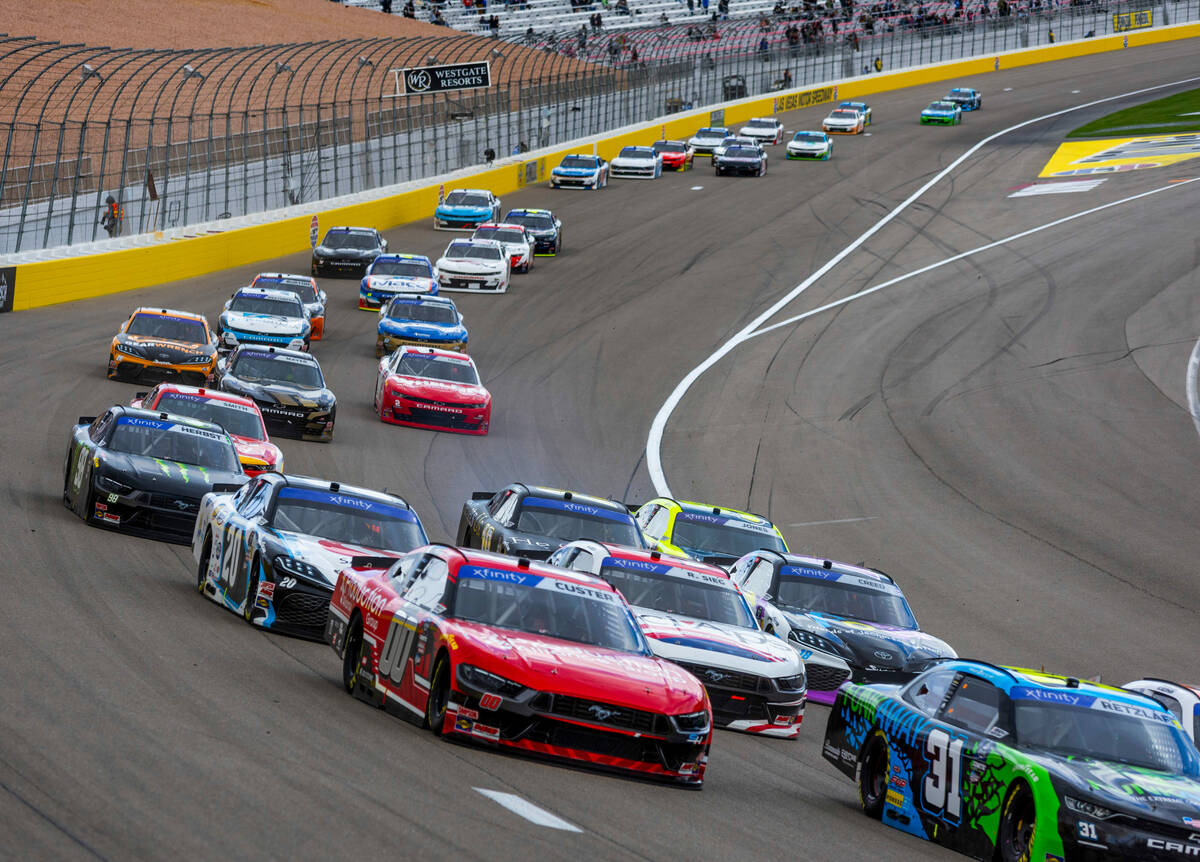 Cars navigate into turn 1 during the LiUNA NASCAR Xfinity Series race at the Las Vegas Motor S ...