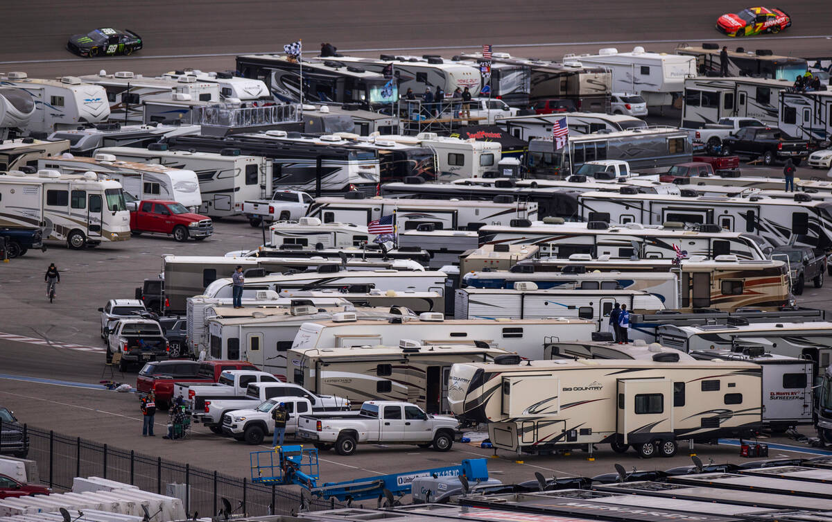 Drivers Riley Herbst, 98, drives past RV's parked in the infield during the LiUNA NASCAR Xfinit ...