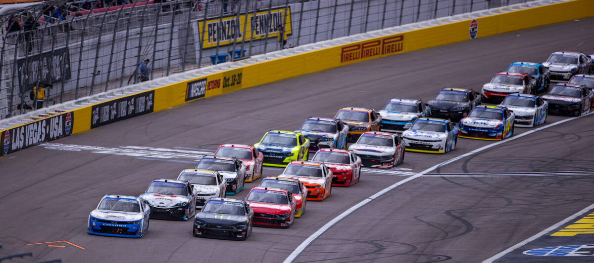 Drivers Riley Herbst, 98, and Austin Hill, 21, lead the pack into turn 3 during the LiUNA NASCA ...