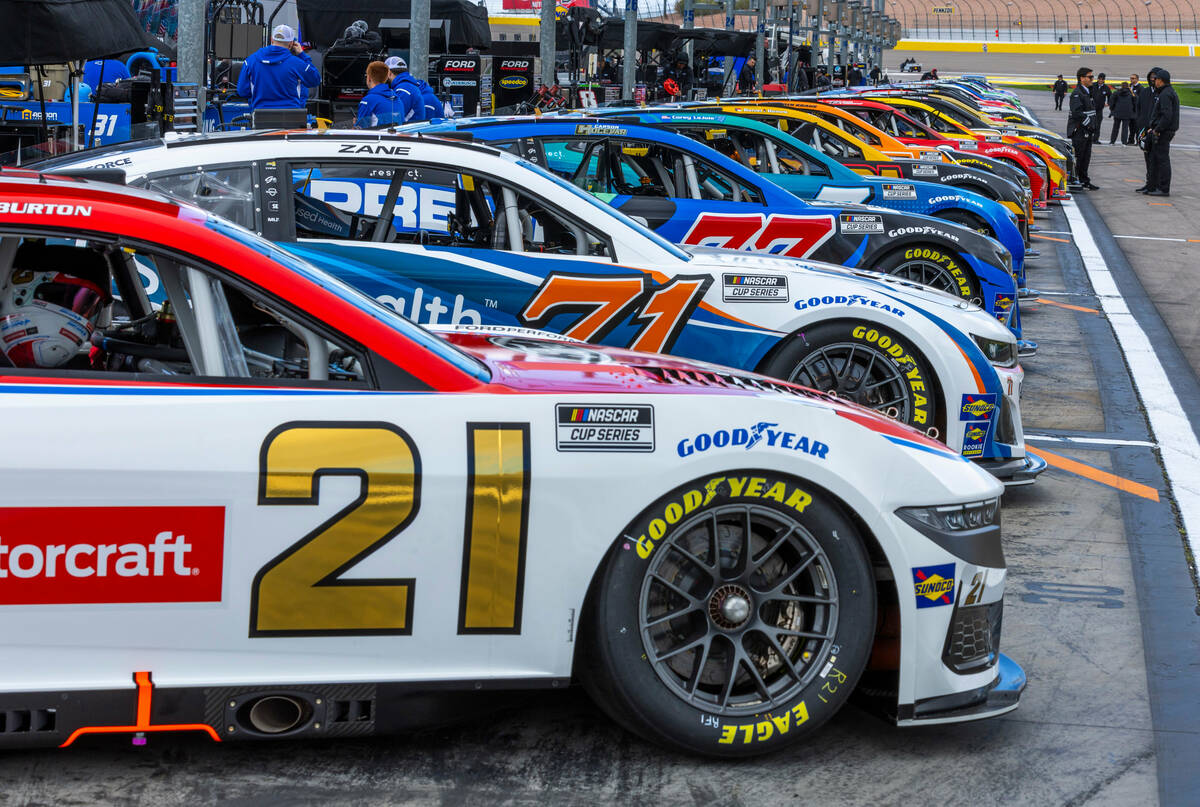 NASCAR racing cars are lined up in the post area before the Pennzoil 400 practice/qualifying at ...