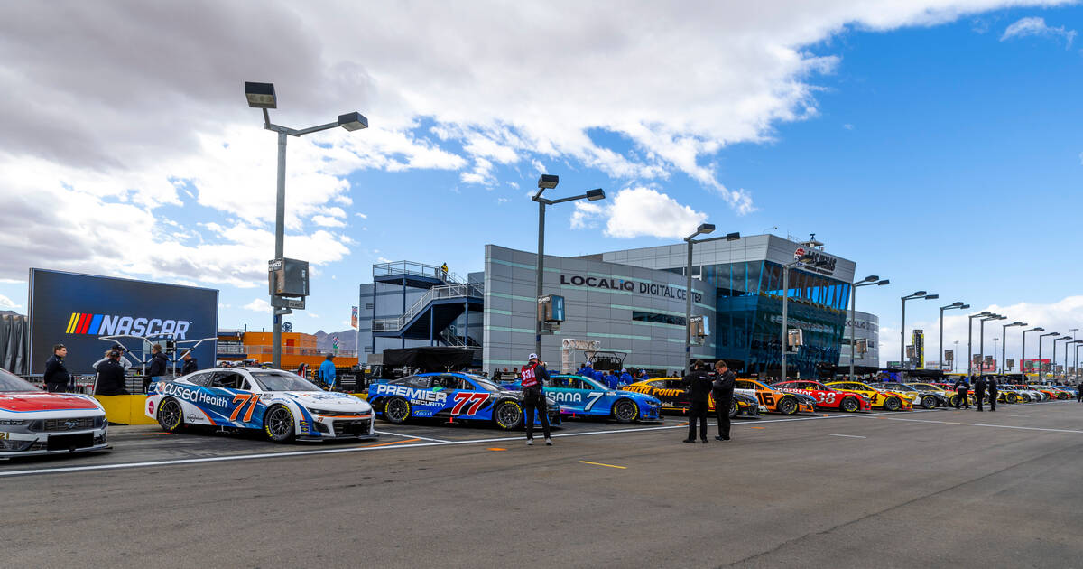 NASCAR racing cars are lined up in the post area before the Pennzoil 400 practice/qualifying at ...