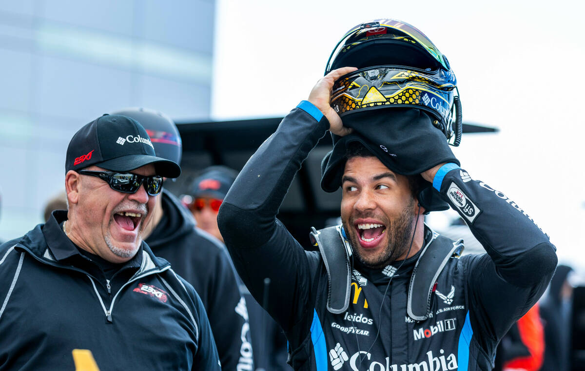 Driver Bubba Wallace, #23 with 23XI Racing Toyota, shares a laugh in his pit before the Pennzo ...