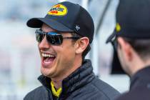 Driver Joey Logano, #22 of Team Penske Ford, shares a laugh in his pit before the Pennzoil 400 ...