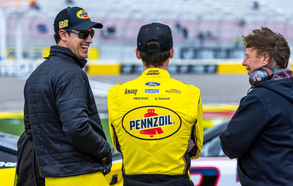 (From left) Driver Joey Logano, #22, laughs with teammate Ryan Blaney, #12, of Team Penske For ...
