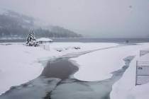Snow covers the shore on Donner Lake, Saturday, March 2, 2024, in Truckee, Calif. A powerful b ...