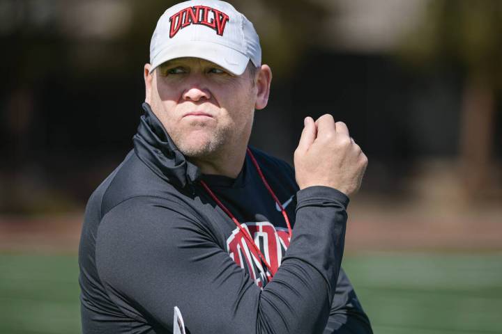 UNLV football head coach Barry Odom watches his team on the first day of practice Saturday, Mar ...