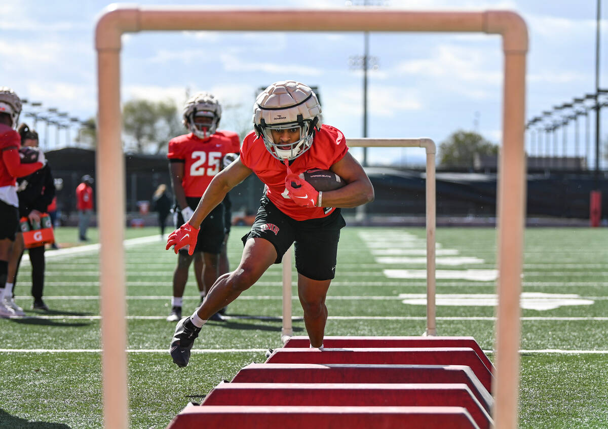 UNLV running back Michael Allen runs a drill during the first day of spring practice Saturday, ...