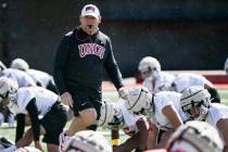 UNLV football head coach Barry Odom watches his team on the first day of practice Saturday, Mar ...