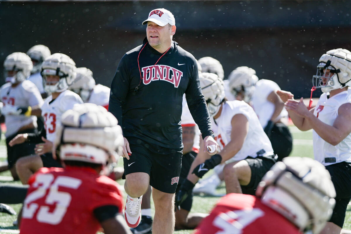 UNLV football head coach Barry Odom watches his team on the first day of practice Saturday, Mar ...